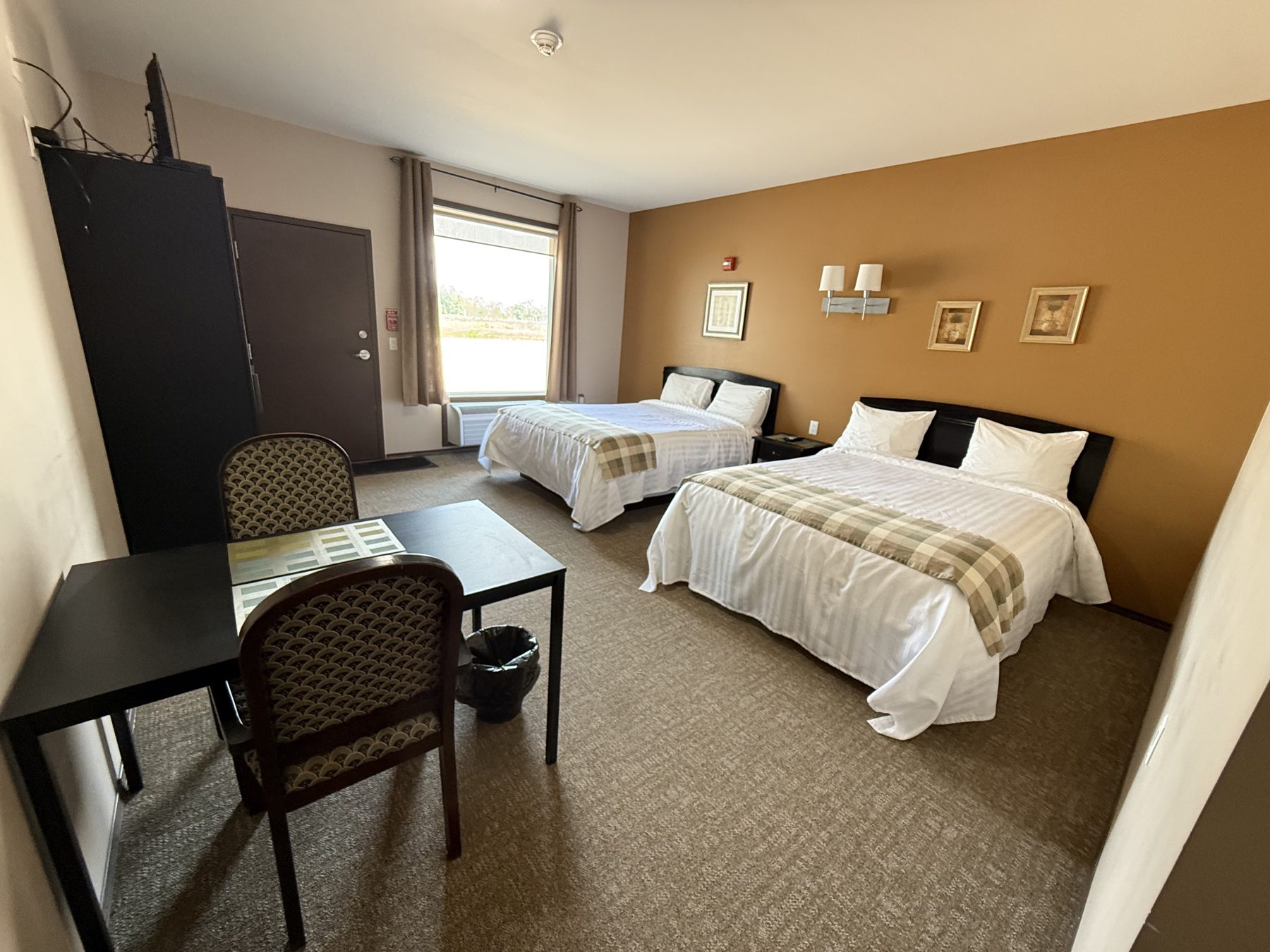 Guest room interior with seating at Moosehorn Motor Hotel