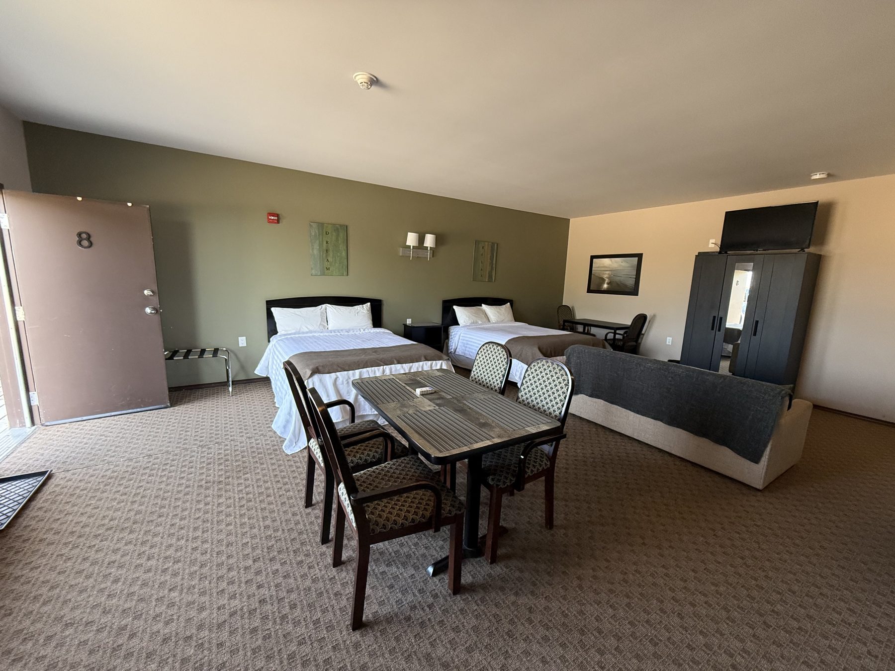 Kitchenette room at Moosehorn Motor Hotel with dining area and two queen beds