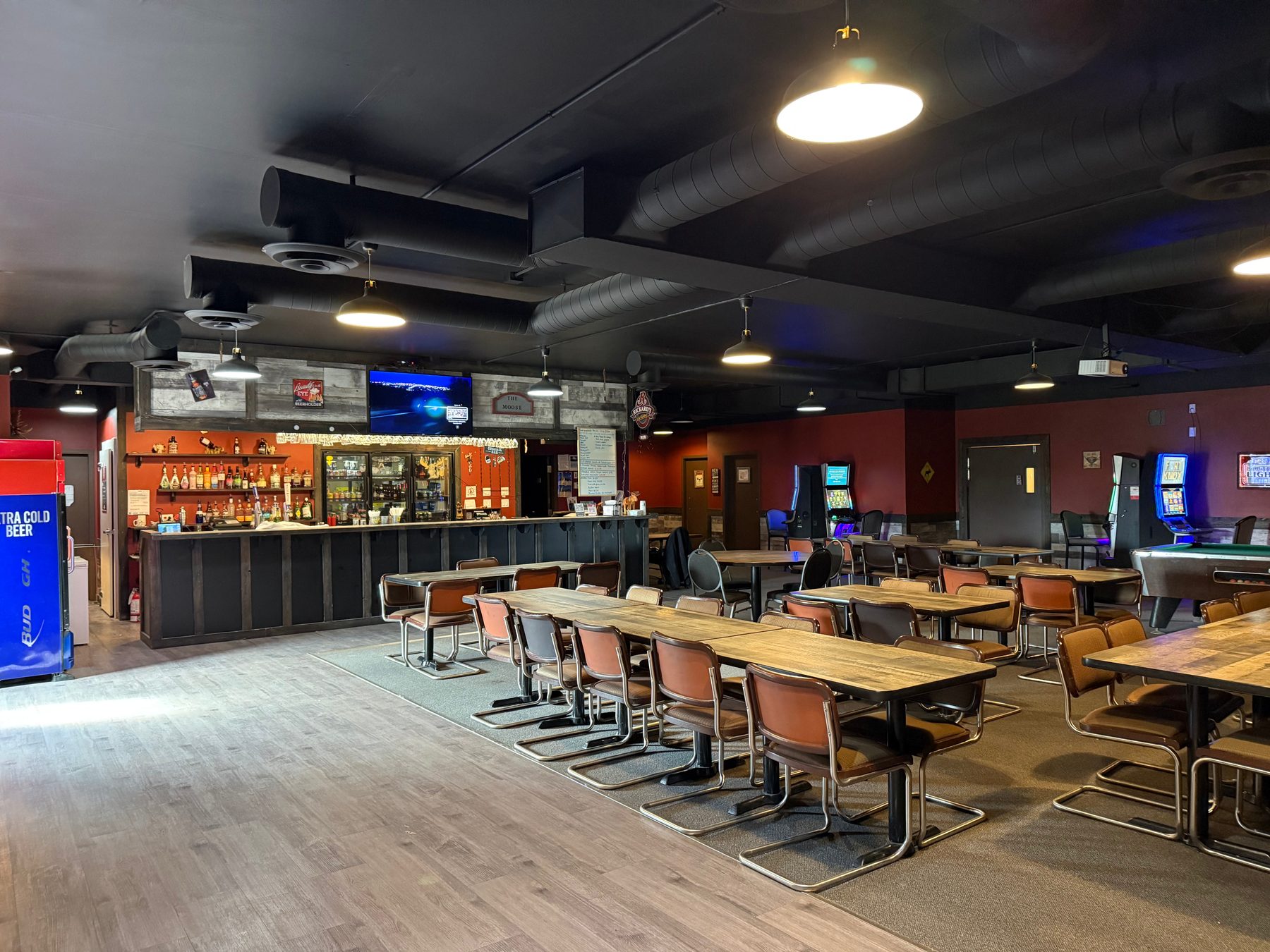 Bar and lounge at Moosehorn Motor Hotel with tables and seating
